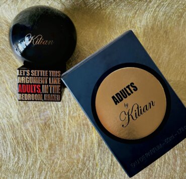 profumo kilian adults flat lay