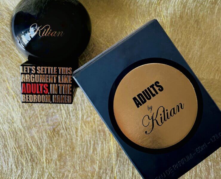 profumo kilian adults flat lay